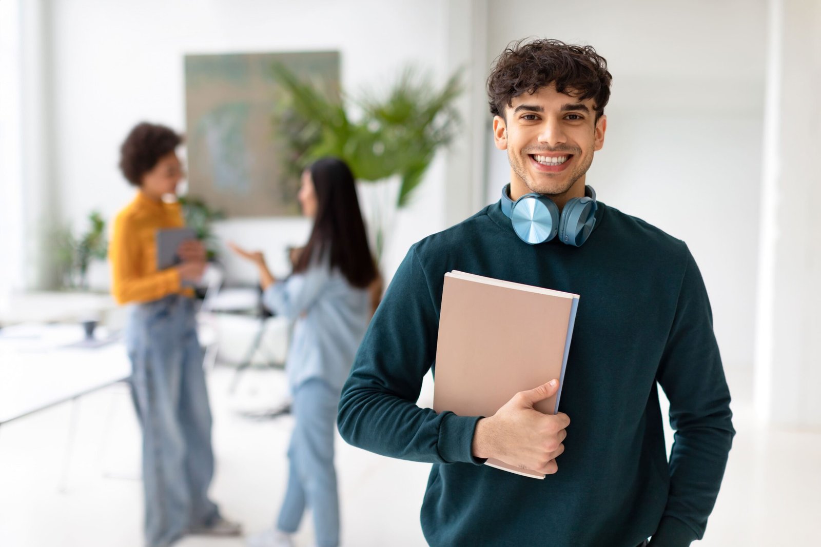 happy-european-student-guy-standing-with-workbooks-2026-01-08-23-05-42-utc